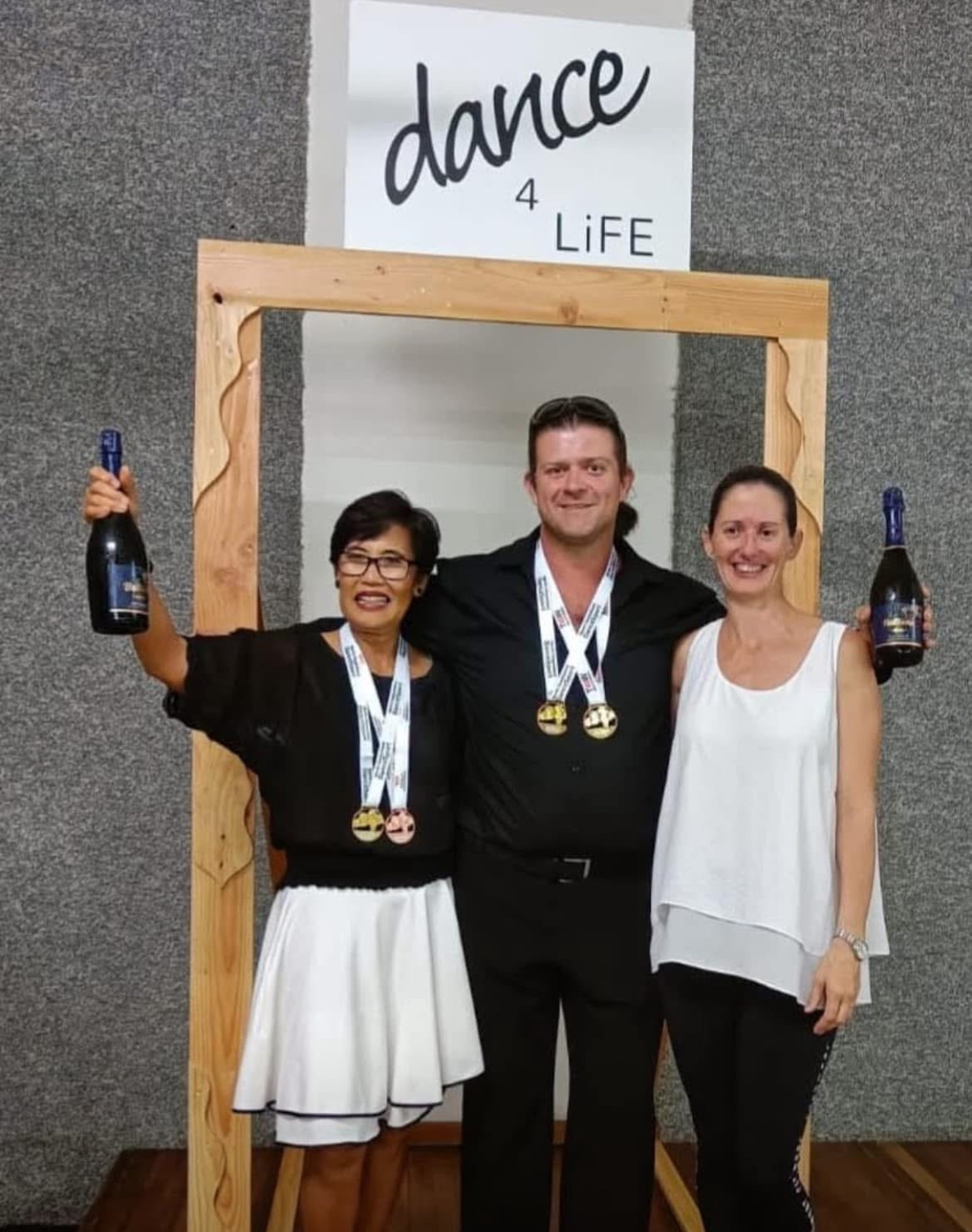 dance4Life FNQ competition winners celebrating with medals